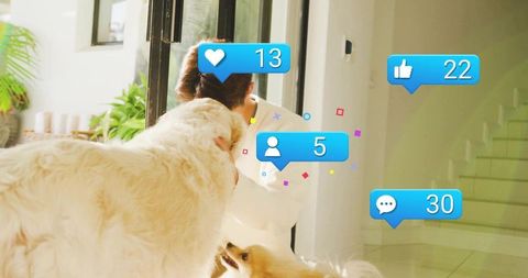 Teen petting two dogs at sunlit home entry with social media reaction icons