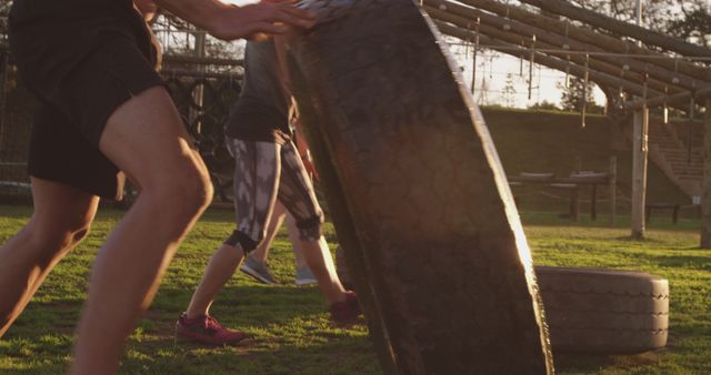 Group Flipping Tires in Outdoor Gym at Sunrise - Download Free Stock Images Pikwizard.com