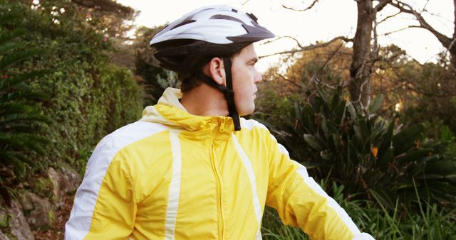 Cyclist in Yellow Jacket Enjoying Nature - Download Free Stock Images Pikwizard.com