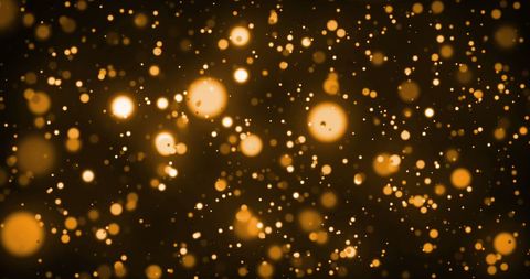 Glowing orange sparkles over dark background
