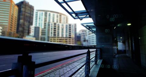 Urban covered walkway with metal railing and glass canopy lights glowing at dusk