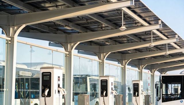 Solar-canopy ev bus charging stations charging electric fleet at urban transit depot