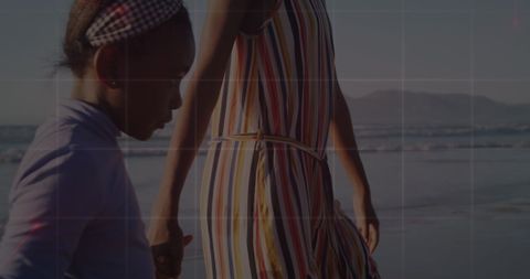 Mother and Daughter Connecting on Beach Walk with Digital Overlay