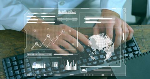 Businessman typing with digital financial analytics overlay