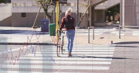 Walking man pushing road bike on zebra crossing wearing red jacket with graph overlay