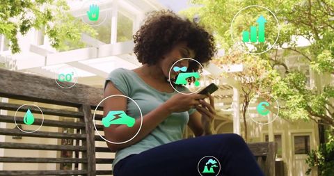 Woman Engaging with Eco-Friendly Digital Interface Outdoors