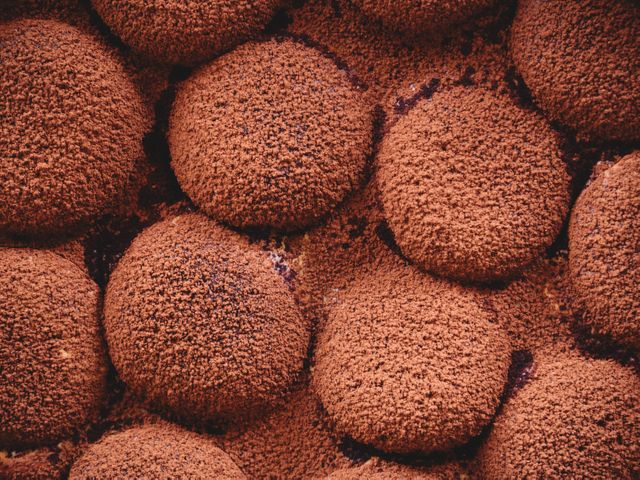 Close-Up of Freshly Baked Chocolate Cookies Covered in Cocoa Powder - Download Free Stock Photos Pikwizard.com