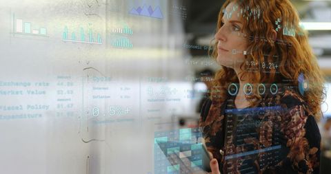 Businesswoman Analyzing Financial Projections with Digital Overlay - Download Free Stock Images Pikwizard.com