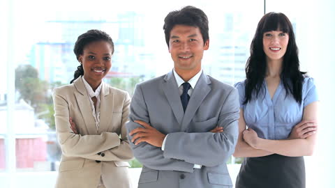 Diverse Business Team Standing Confidently in Office Environment