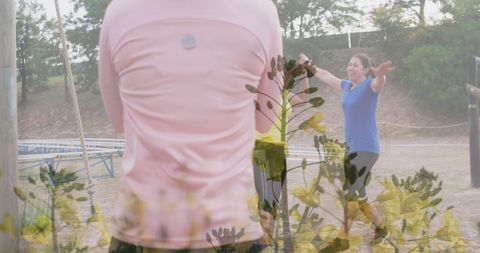 Diverse Women High-Fiving at Outdoor Obstacle Course