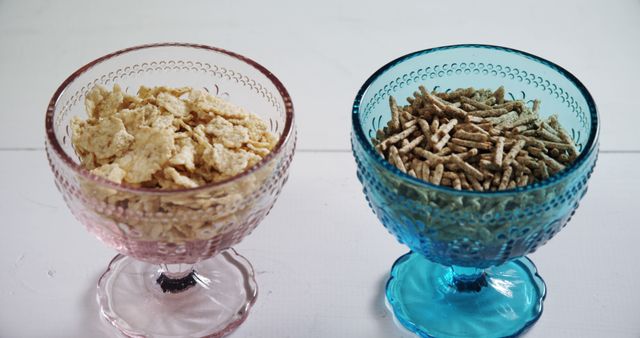 Two Types of Breakfast Cereals in Glass Bowls on White Table - Download Free Stock Images Pikwizard.com