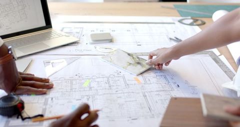 Architects Collaborating on Construction Blueprints and Materials - Download Free Stock Images Pikwizard.com