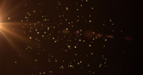 Golden Sparkles Floating Against Dark Background - Download Free Stock Images Pikwizard.com