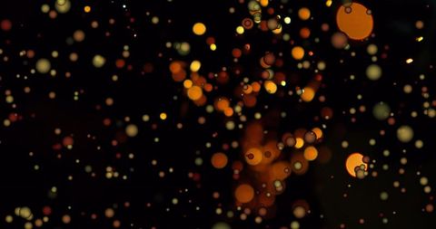 Glowing Bokeh Orbs Over Dark Backdrop in Cosmic Atmosphere