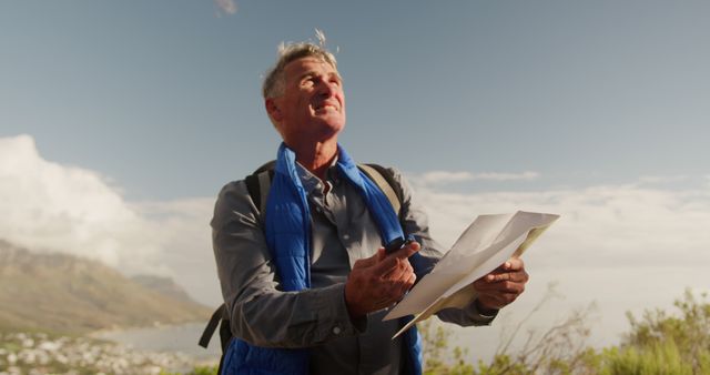 Senior Man Navigating with Map on Mountainous Hike - Download Free Stock Images Pikwizard.com