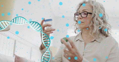 Senior woman reading medication labels at home with dna overlay representing genomics