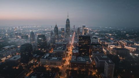 Dusk aerial view of illuminated charlotte urban skyline with skyscrapers