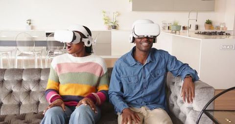 African American Couple Enjoying Virtual Reality at Home