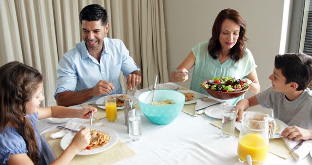 Happy Family Enjoying Healthy Meal Together at Home - Download Free Stock Images Pikwizard.com