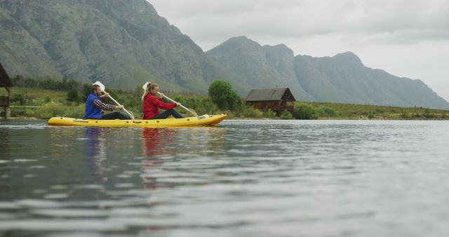Family Kayaking on Calm Lake in Mountain Landscape - Download Free Stock Images Pikwizard.com