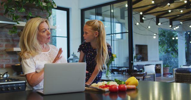 Grandmother and Granddaughter Cooking Together with Laptop - Download Free Stock Images Pikwizard.com