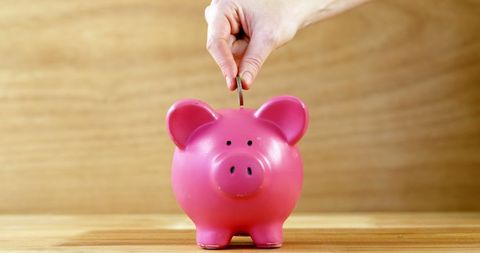 Hand Placing Coin into Pink Piggy Bank for Savings Concept - Download Free Stock Images Pikwizard.com