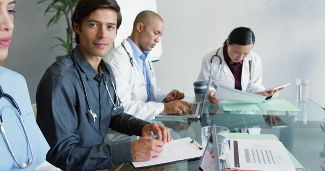 Diverse Medical Team Collaborating in Meeting Room - Download Free Stock Images Pikwizard.com