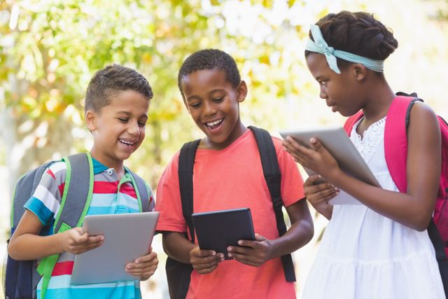 School kids using digital tablet at school campus