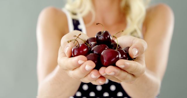 Close-up of Woman's Hands Holding Fresh Cherries - Download Free Stock Images Pikwizard.com