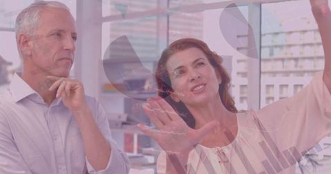 Business Colleagues Analyzing Data Charts in Modern Office