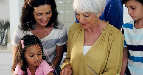 Grandmother Cutting Vegetables While Family Cooking Together in Bright Home Kitchen