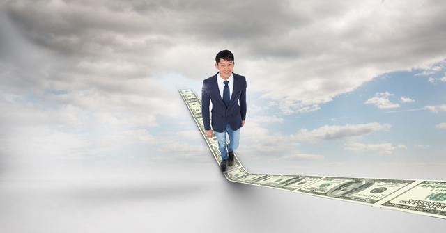 This image depicts a businessman walking confidently on a pathway made of dollar bills, leading upward toward the sky. The background features a cloudy sky, symbolizing aspirations and financial growth. It is ideal for use in presentations, articles, and advertisements related to financial services, investment, economic growth, corporate strategy, and success stories.