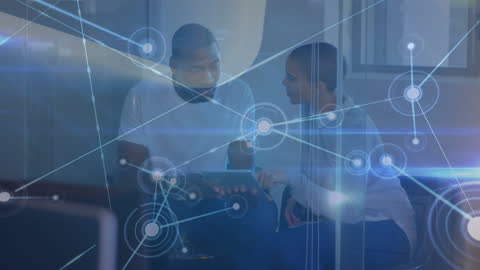 Diverse Colleagues Discussing Technology Concepts with Digital Overlay