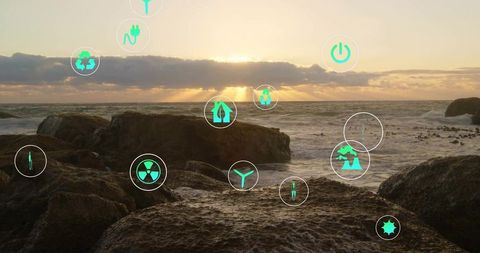 Green Energy Icons Over Coastal Sunset Scenery