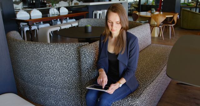 Businesswoman Using Tablet in Modern Office Lounge Area - Download Free Stock Images Pikwizard.com