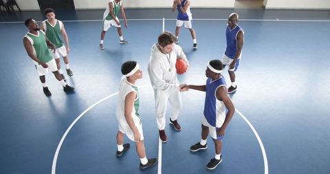 Diverse Basketball Players and Coach Team Building