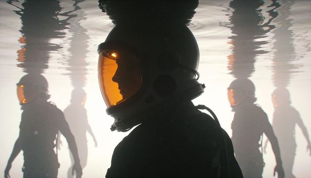 Futuristic helmeted crew standing in liquid with orange visors and mirrored reflections