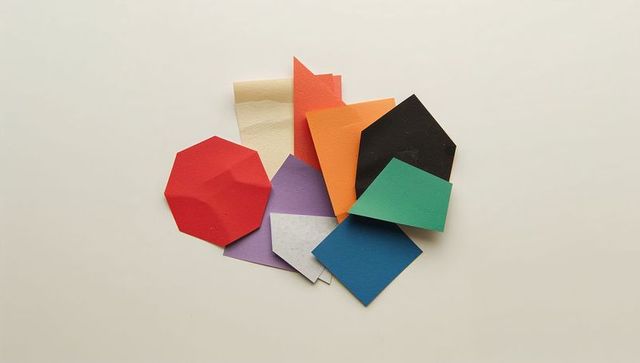 Abstract arrangement of colorful paper cutouts overlapping