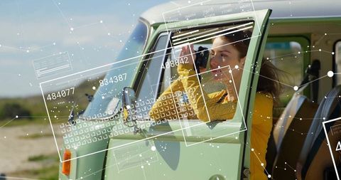 Woman Exploring Coast With Binoculars and Futuristic Display