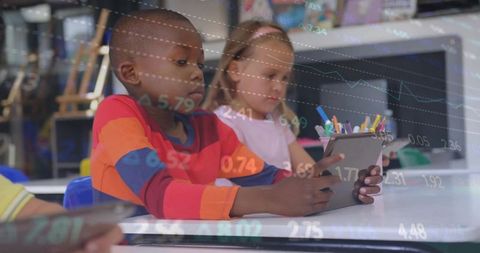 Diverse Children Learning with Tablets in Classroom Environment