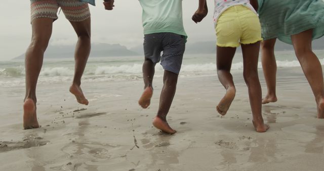 Family Running on Beach, Enjoying Summer Vacation - Download Free Stock Images Pikwizard.com