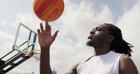Confident Basketball Player Spinning Ball Outdoors on Finger - Download Free Stock Images Pikwizard.com