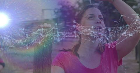 Athletic woman refreshing mid-exercise with digital network overlay