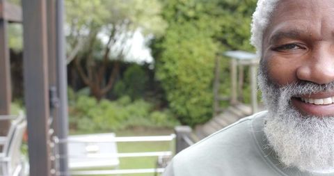 Senior Man with White Beard Standing in Relaxed Outdoor Setting
