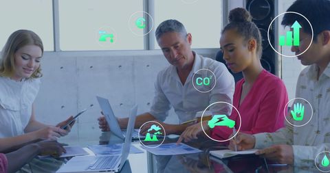 Diverse business team analyzing digital icons and data concepts