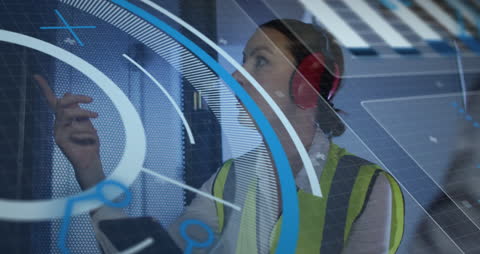 Caucasian Female Engineer Analyzing Data Interface in Server Room