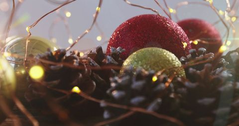 Festive Christmas Baubles with Pine Cones and Fairy Lights - Download Free Stock Images Pikwizard.com
