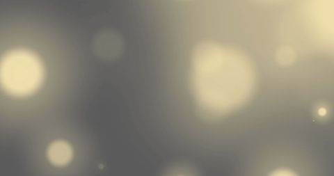 Abstract yellow glowing lights on grey background
