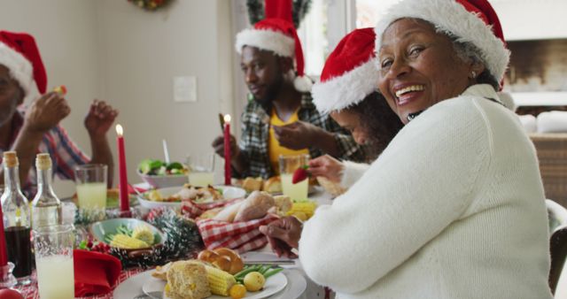 African American family wearing Santa hats enjoying a festive meal. Perfect for themes around family gatherings, holiday celebrations, Christmas spirit, and togetherness during the festive season.