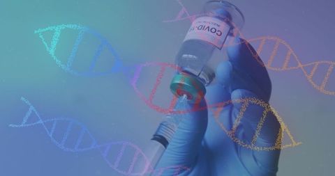 Doctor holding covid-19 vaccine syringe with dna graphics